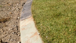 Two different colours of concrete garden edging
